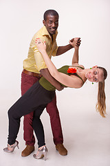 Image showing Young couple dances Caribbean Salsa, studio shot