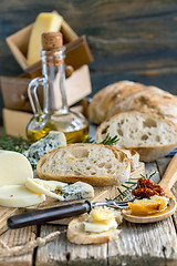 Image showing Homemade bread, cheese and olive oil.
