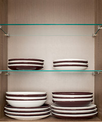 Image showing mixed clean white and brown dishes 