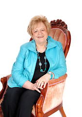 Image showing Senior woman sitting in armchair.