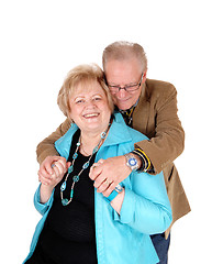 Image showing Senior man hugging his wife.