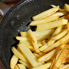 Image showing Roasted potato chips in a frying pan