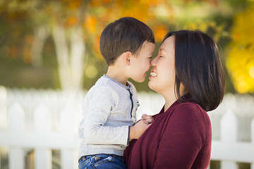 Image showing Chinese Mom Having Fun and Holding Her Mixed Race Boy