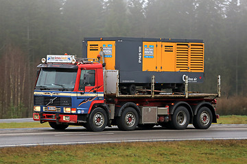 Image showing Retro Volvo FL10 320 Truck Hauls a Compressor