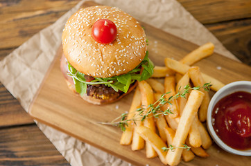 Image showing Home made burgers on wooden background