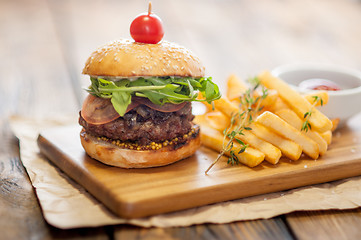 Image showing Home made burgers on wooden background