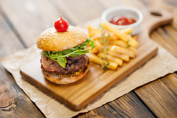 Image showing Home made burgers on wooden background