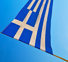 Image showing waving greece flag in the blue sky and flagpole