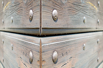 Image showing abstract texture of a brown antique wooden old door in italy   e