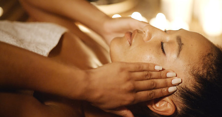 Image showing Young Woman Massaging Her Face