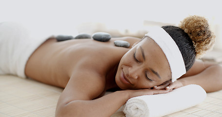 Image showing Woman Getting Hot Stones Massage At Spa