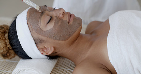 Image showing Woman With Clay Facial Mask In Spa