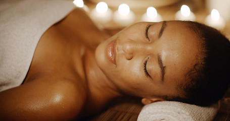 Image showing Young Girl At Spa Salon By Candle Light