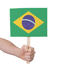 Image showing Hand holding small card - Flag of Brazil