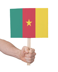 Image showing Hand holding small card - Flag of Cameroon