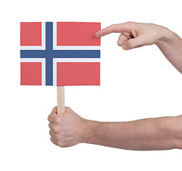 Image showing Hand holding small card - Flag of Norway