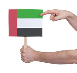 Image showing Hand holding small card - Flag of Sudan