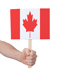 Image showing Hand holding small card - Flag of Canada