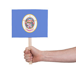 Image showing Hand holding small card - Flag of Minnesota