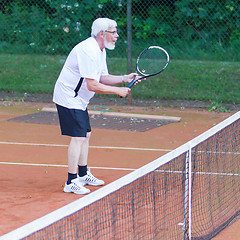 Image showing Senior man playing tennis