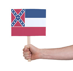 Image showing Hand holding small card - Flag of Mississippi