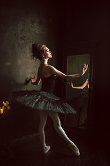 Image showing Portrait of the ballerina in ballet tatu on black background