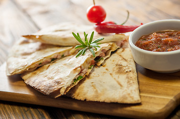 Image showing Tacos on wooden background with sauce