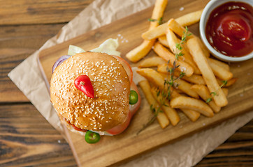Image showing Home made burgers on wooden background