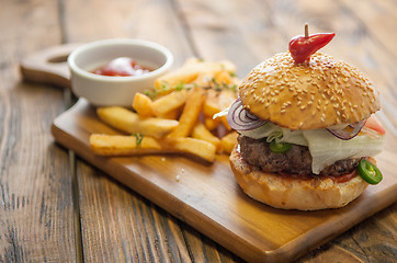 Image showing Home made burgers on wooden background