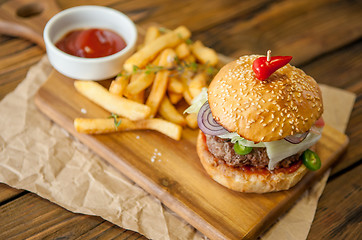 Image showing Home made burgers on wooden background