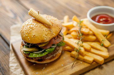 Image showing Home made burgers on wooden background