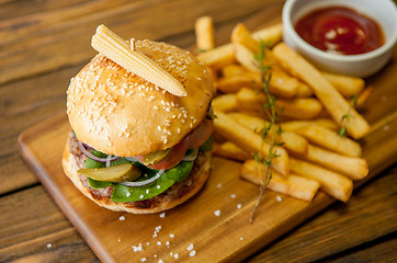 Image showing Home made burgers on wooden background