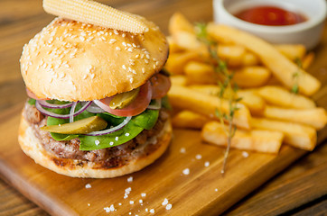 Image showing Home made burgers on wooden background