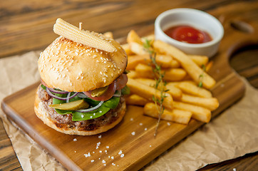 Image showing Home made burgers on wooden background