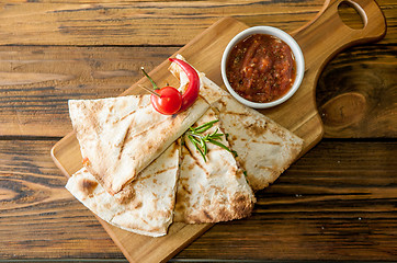 Image showing Tacos on wooden background with sauce