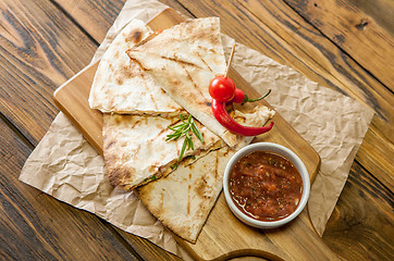 Image showing Tacos on wooden background with sauce
