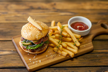 Image showing Home made burgers on wooden background