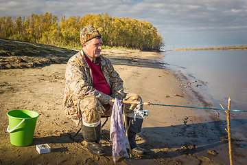 Image showing Fisherman at the river