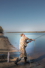 Image showing Fisherman at the river