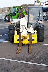 Image showing two forklift standing in the harbour 