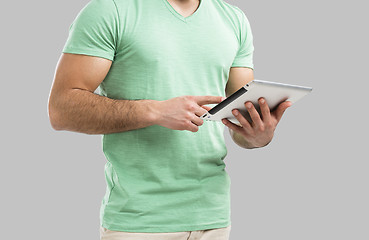 Image showing Man working with a tablet, 