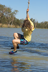 Image showing girl swinging