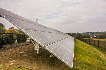 Image showing green energy solar panels on a cloudy day