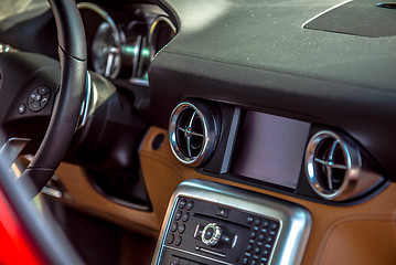 Image showing luxury car interior dash steering wheel and controls