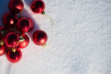 Image showing red christmas ball in fresh snow