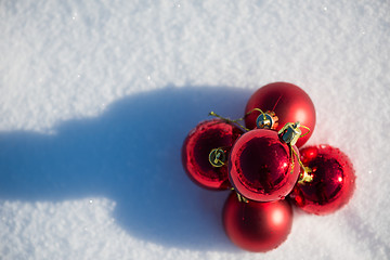 Image showing red christmas ball in fresh snow