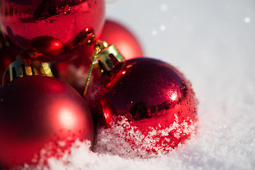 Image showing red christmas ball in fresh snow