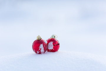 Image showing red christmas balls in fresh snow