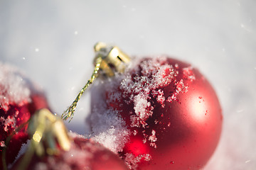 Image showing red christmas ball in fresh snow