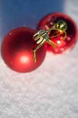 Image showing red christmas ball in fresh snow